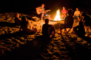 Idaho. Lower Salmon River. Playing guitar around campfire. MR